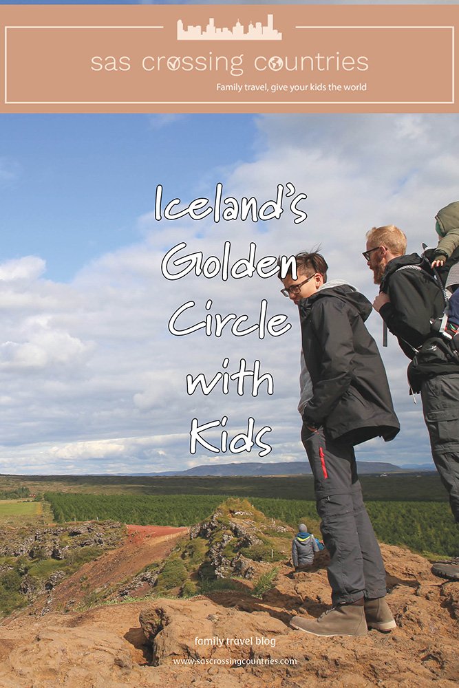 Cover image for a family travel blog post titled "Iceland's Golden Circle with kids," showcasing a father with a baby in a back carrier and a teen boy enjoying the view of the Icelandic landscape. The blog URL "www.sascrossingcountries.com" is visible at the bottom
