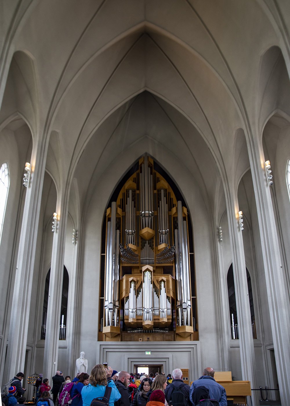Interior of Hallgrimskirkja, a Lutheran church in Reykjavik, Iceland, featuring a large pipe organ and high arched ceilings