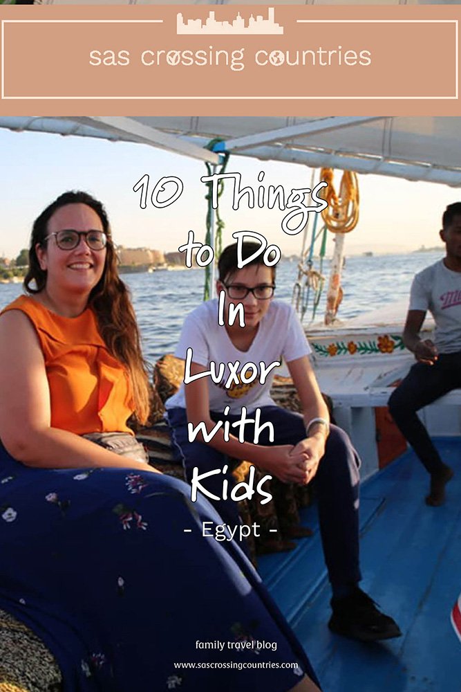 Cover image for a family travel blog post titled "10 Things to Do In Luxor with kids," showcasing a woman and a boy enjoying a felucca ride. The blog URL "www.sascrossingcountries.com" is visible at the bottom.