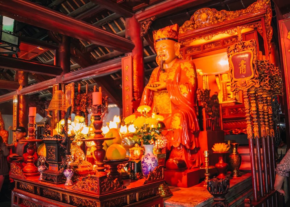 Inside the Temple of Literature in Hanoi, Vietnam: A view inside the Temple of Literature, highlighting its intricate architecture and serene environment.