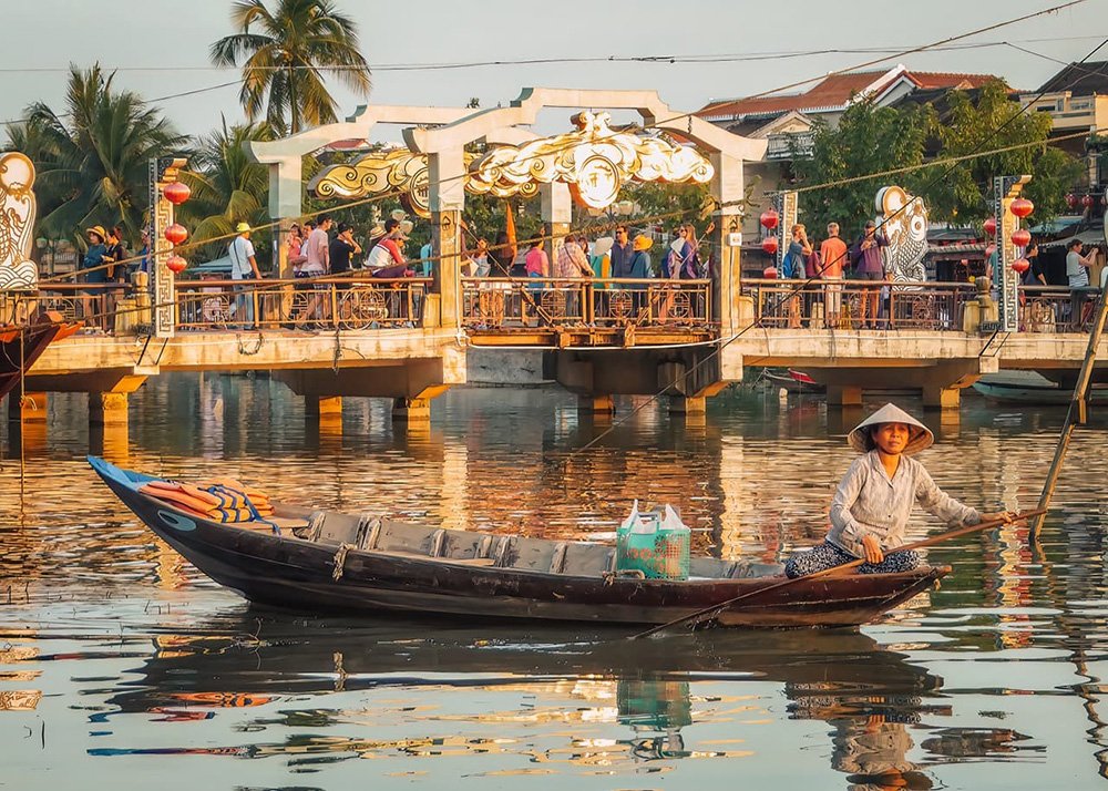 Fisherwoman in Hoi An - Vietnam: A local fisherwoman in Hoi An, preparing her fishing gear by the river.