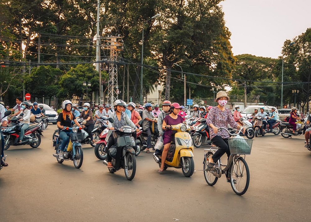 Crazy traffic in Ho Chi Minh City - Vietnam: A chaotic street scene in Ho Chi Minh City with numerous motorbikes and cars.