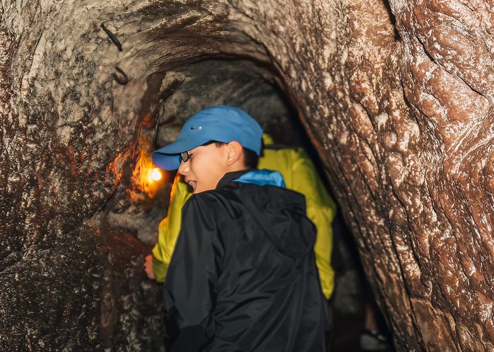 Inside the Cu Chi Tunnels near Ho Chi Minh City in Vietnam: A narrow passage within the Cu Chi Tunnels, showing the confined spaces used during the Vietnam War.