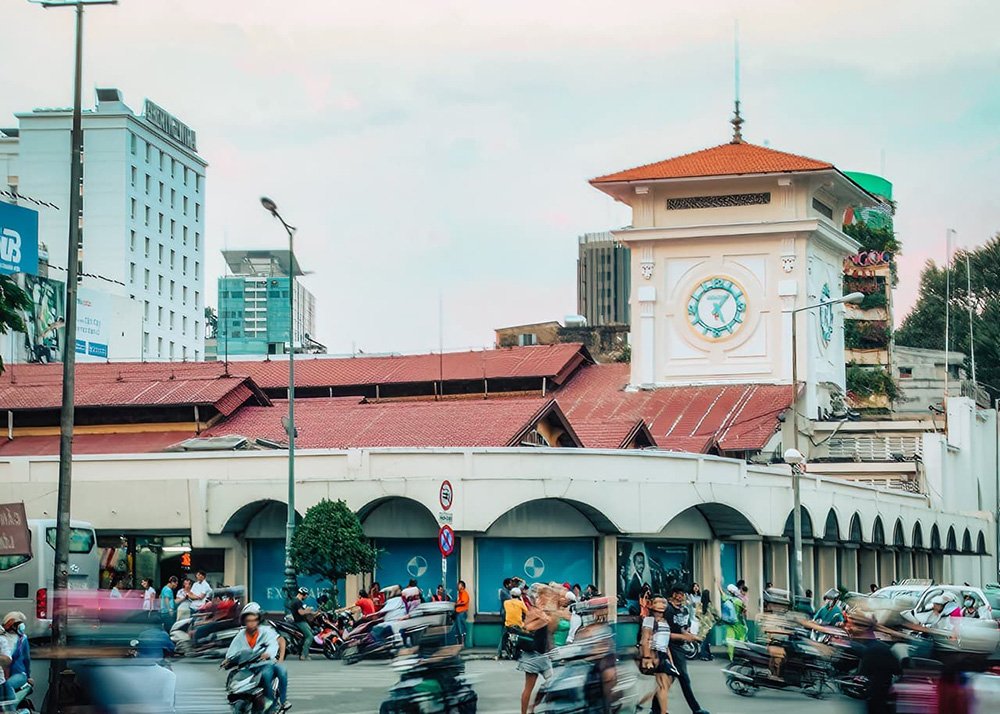 The Ben Thanh Market in Ho Chi Minh City - Vietnam: An exterior view of the Ben Thanh Market building, surrounded by traffic.