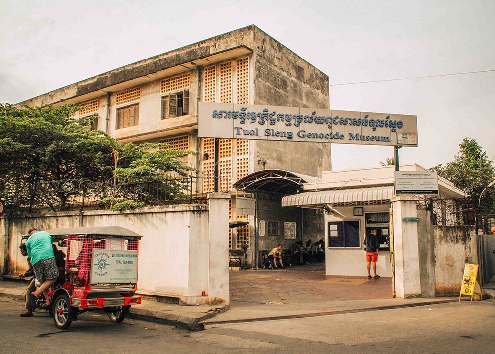 The entrance to the Tuol Sleng Genocide Museum in Phnom Penh, Cambodia, on a cloudy day. The former school, turned prison, now serves as a museum to educate visitors about the atrocities committed during the Khmer Rouge regime.