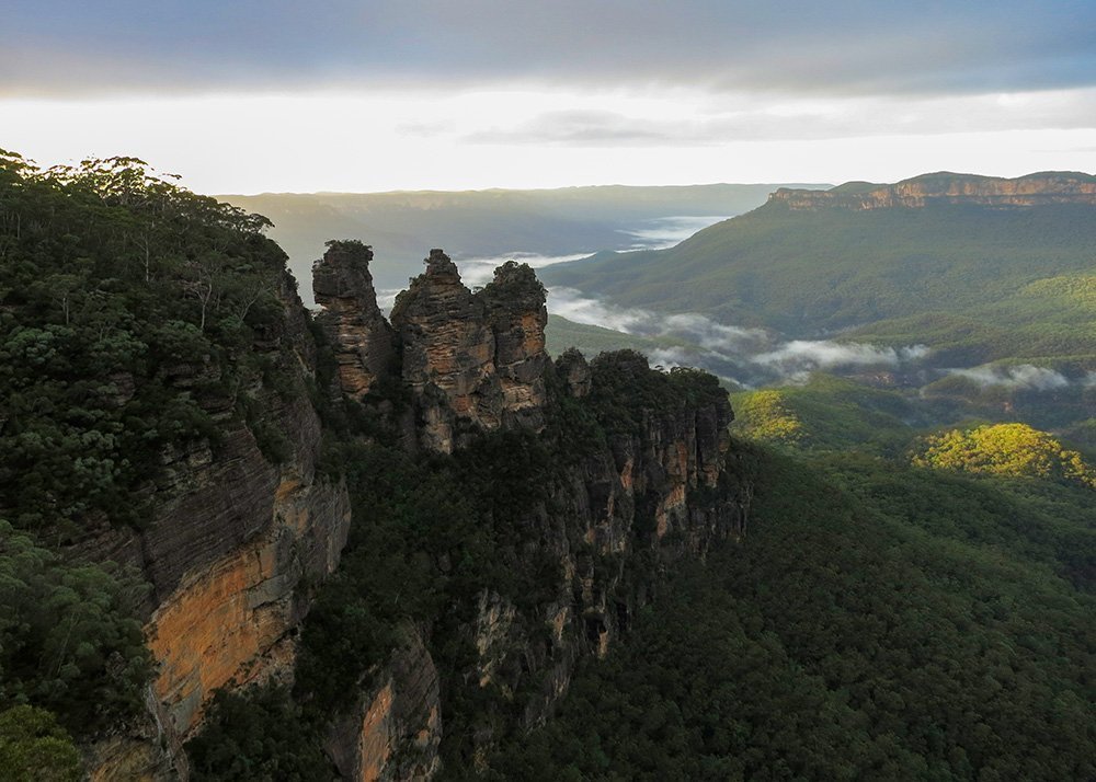 View of the Three Sisters and The Blue mountains on a foggy morning in Australia