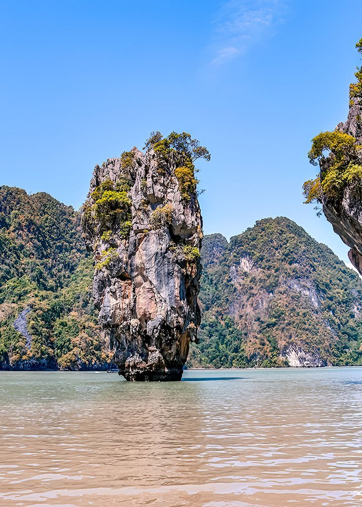 Tall limestone karst island in the middle of Phang Nga Bay, Thailand