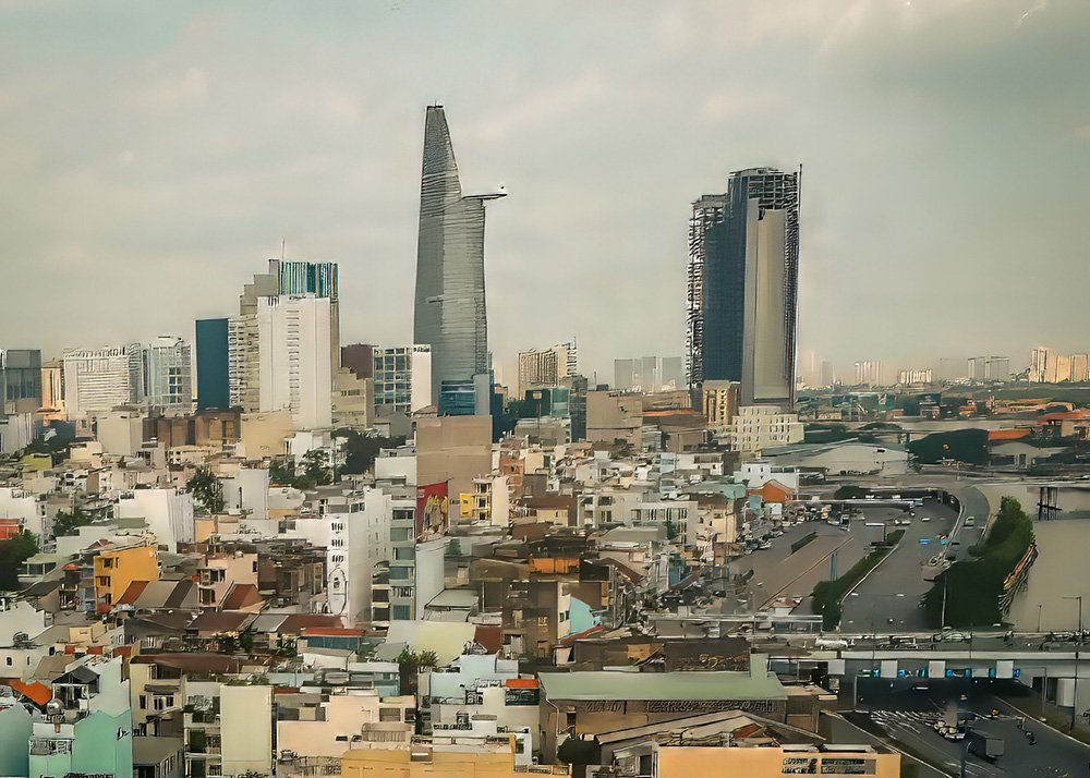 Hotel window view of Ho Chi Min City's skyline - Vietnam: A panoramic view of the bustling skyline of Ho Chi Minh City from a hotel window.