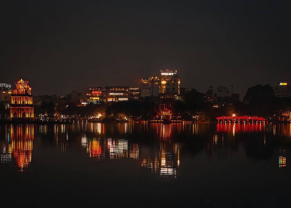 Hoan Kiem Lake in Hanoi at night - Vietnam: The serene Hoan Kiem Lake illuminated at night in Hanoi, Vietnam.