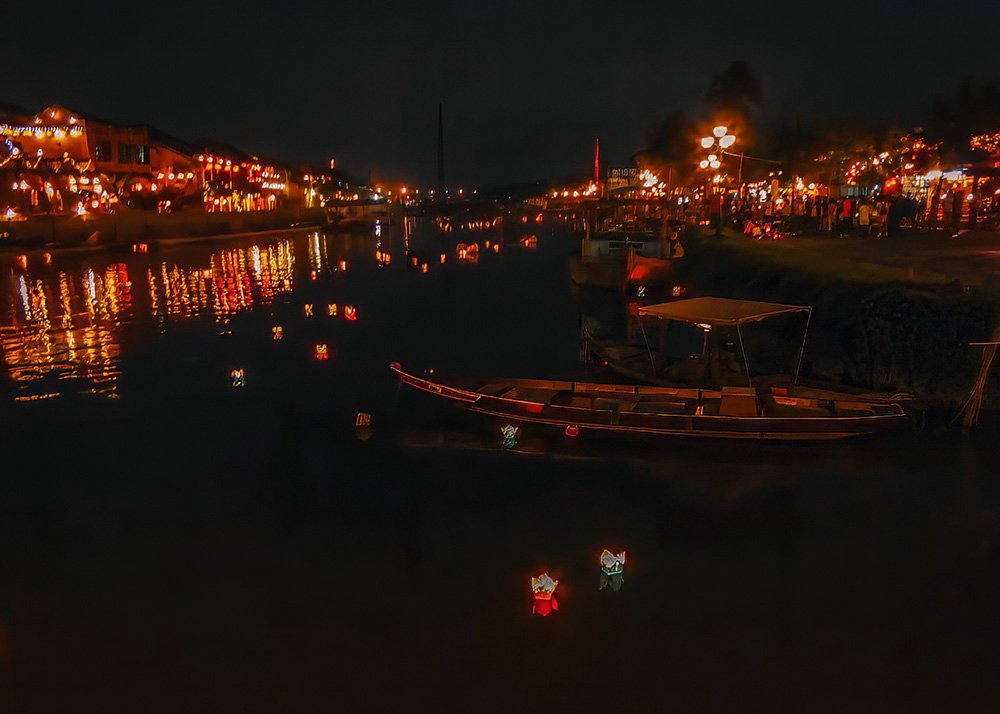 Nightlife in Hoi An - Vietnam: The lively streets of Hoi An at night, filled with lights and people.