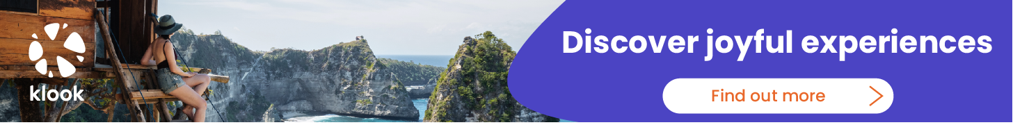 A banner with the text "Klook: Discover joyful experiences. Find out more" The picture on the banner is from a woman enjoying the view of a beach and small rocky islands. Clicking this banner will take you to Klook's website.