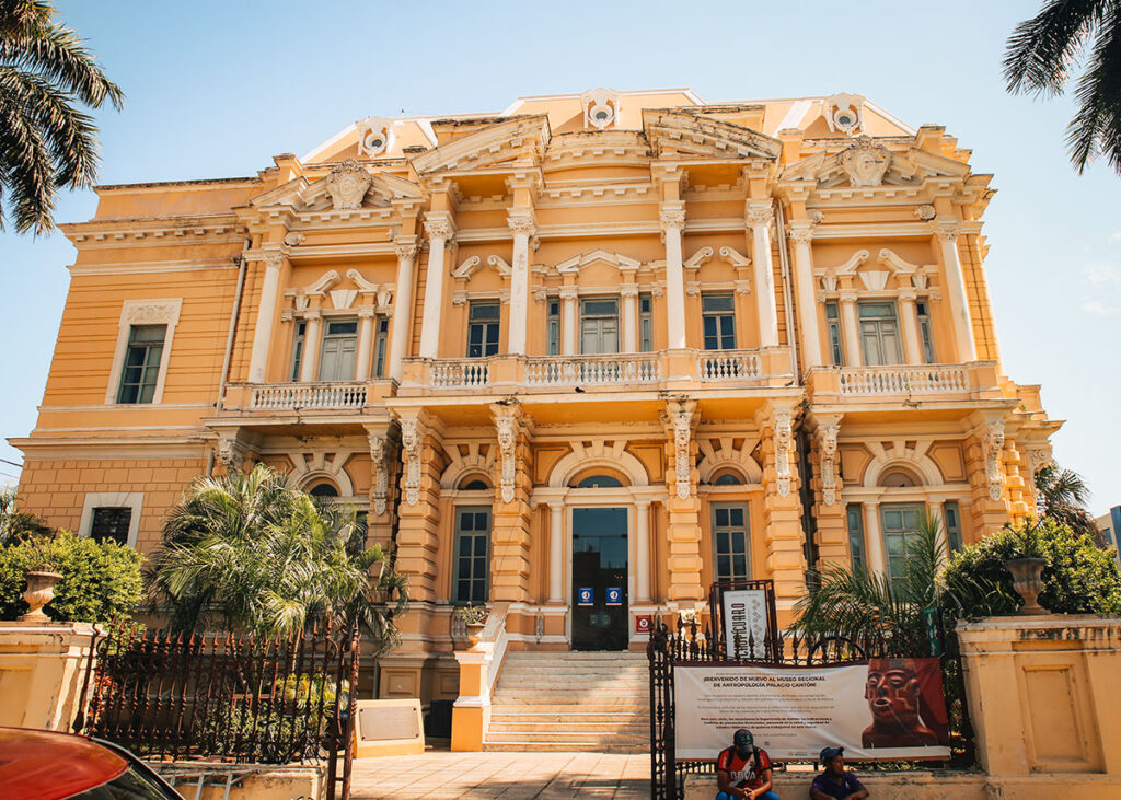 Yellow neoclassical Palacio Cantón in Mérida, home to the Regional Museum of Anthropology, on a sunny day.