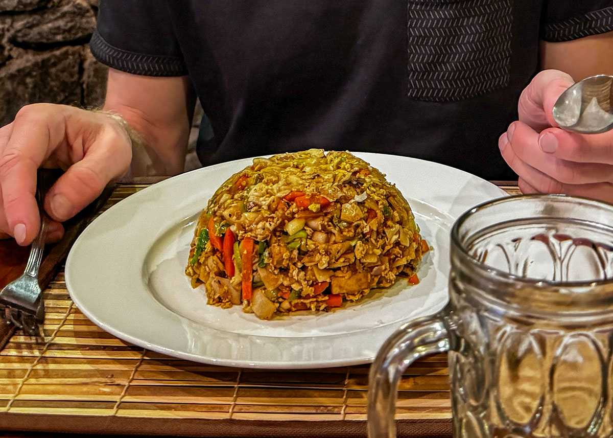 A plate of rotti and an empty beer glass