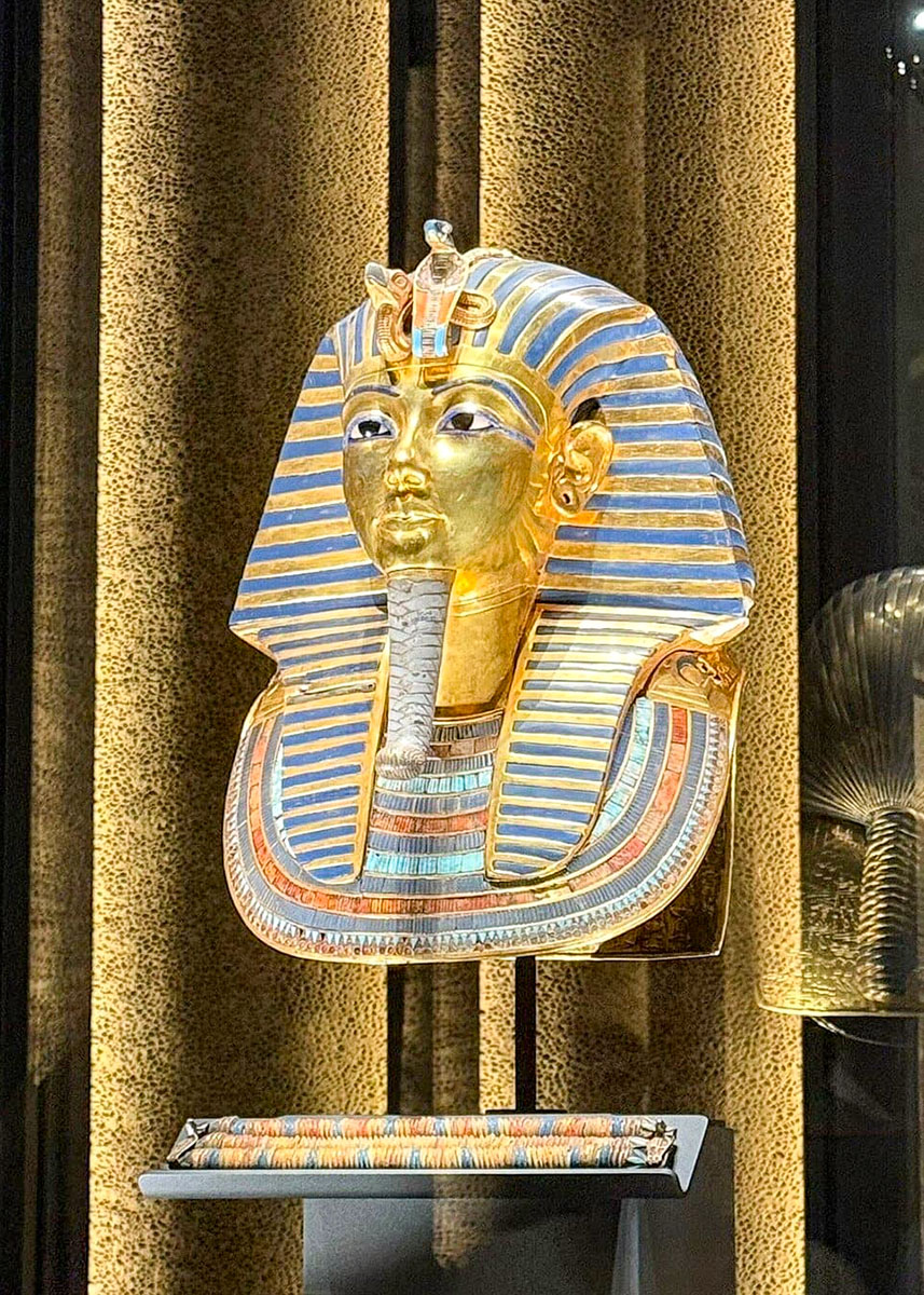 The golden burial mask of Tutankhamun displayed in a glass cabinet in the Grand Egyptian Museum (GEM) in Cairo