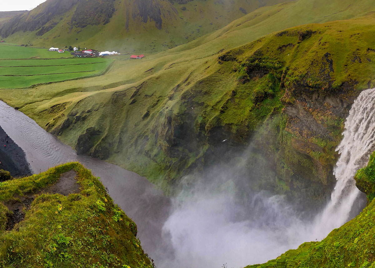 The view from the top of Skogafoss, a waterfall in Iceland.
